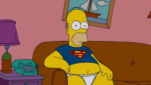 Гомер сидит на диване.