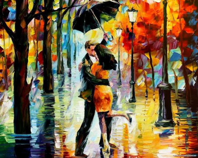 Парень с девушкой под зонтом.