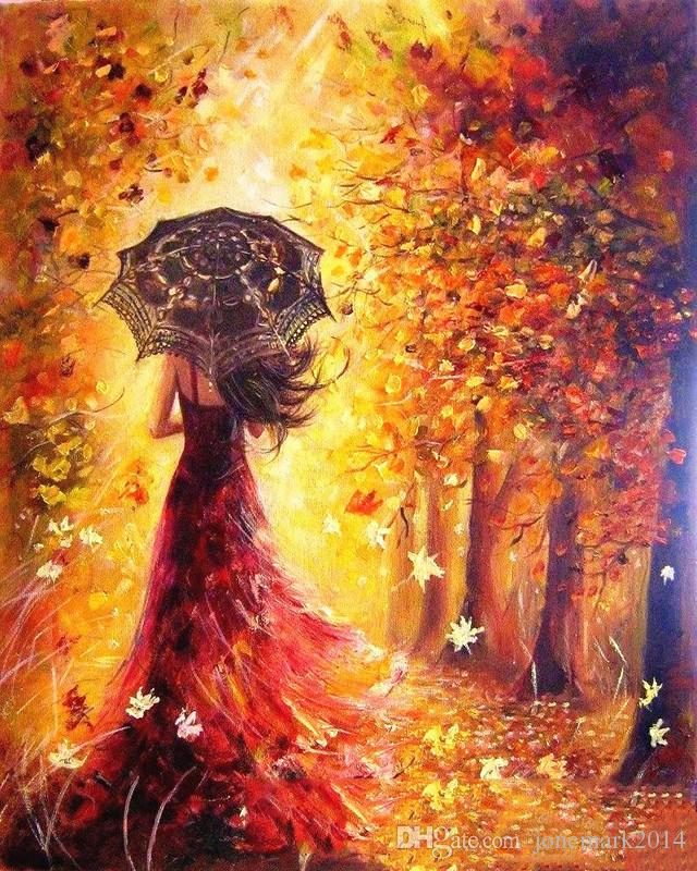 Девушка с зонтиком в осеннем лесу.